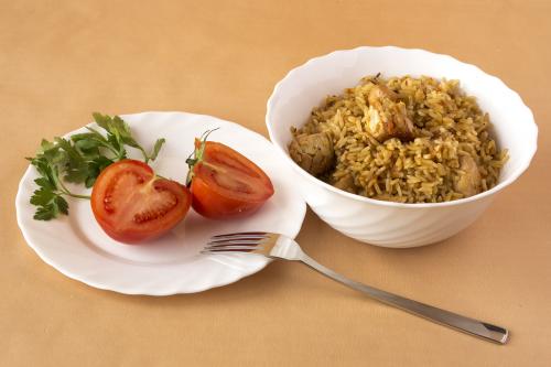 Pilaf and tomatoes