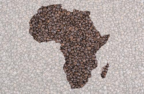 Roasted coffee beans with Africa contour background