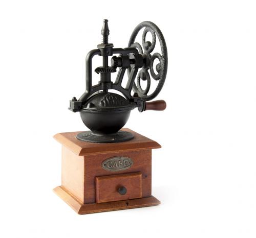 Vintage manual coffee mill isolated on white