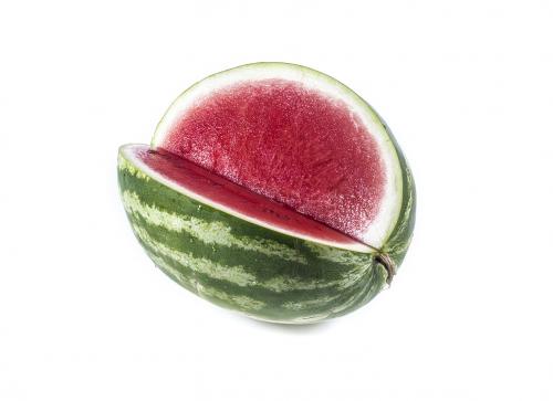 Ripe striped cut watermelon isolated on white