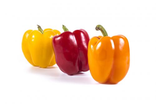 Multicolor sweet peppers isolated on white