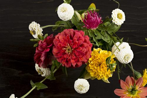 Floral bouquet on a black wooden background